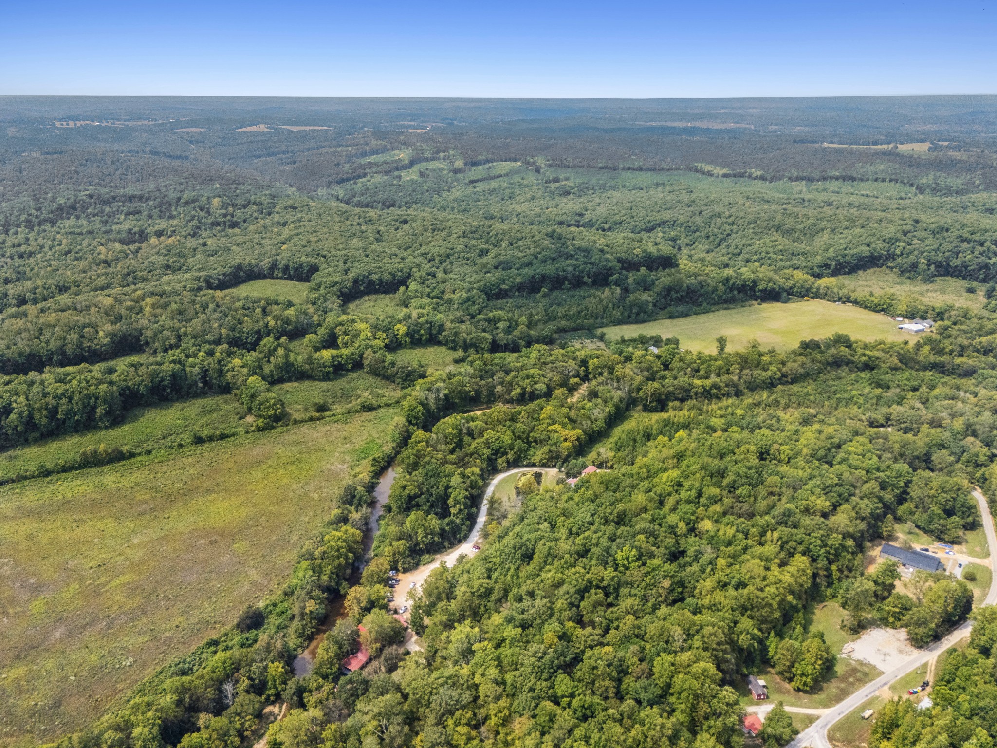 299 Natural Bridge Park Road Waynesboro, TN 38485 - Photo 41 of 63 a view of a field with an ocean and trees