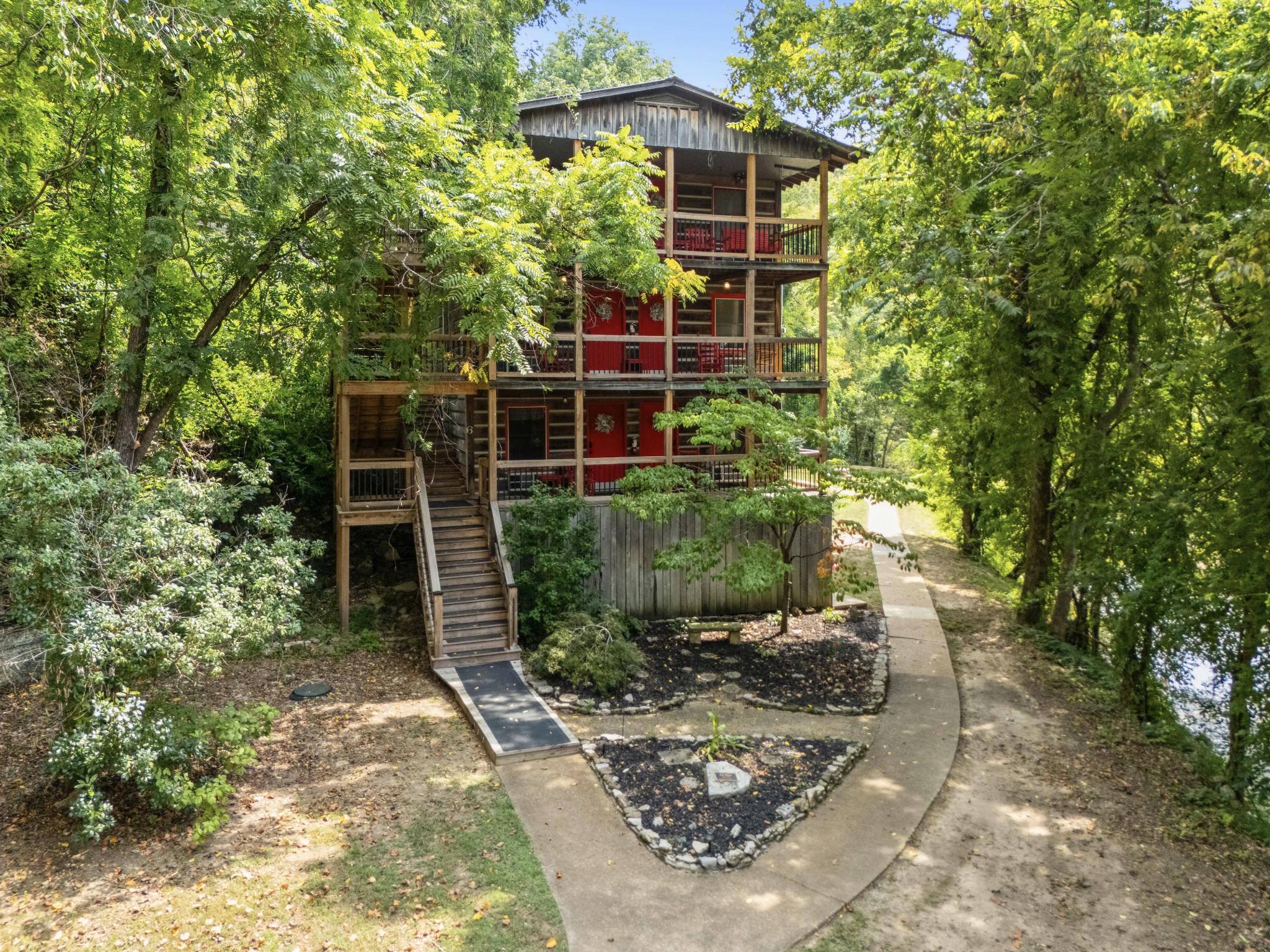 299 Natural Bridge Park Road Waynesboro, TN 38485 - Photo 46 of 63 a backyard of a house with lots of green space