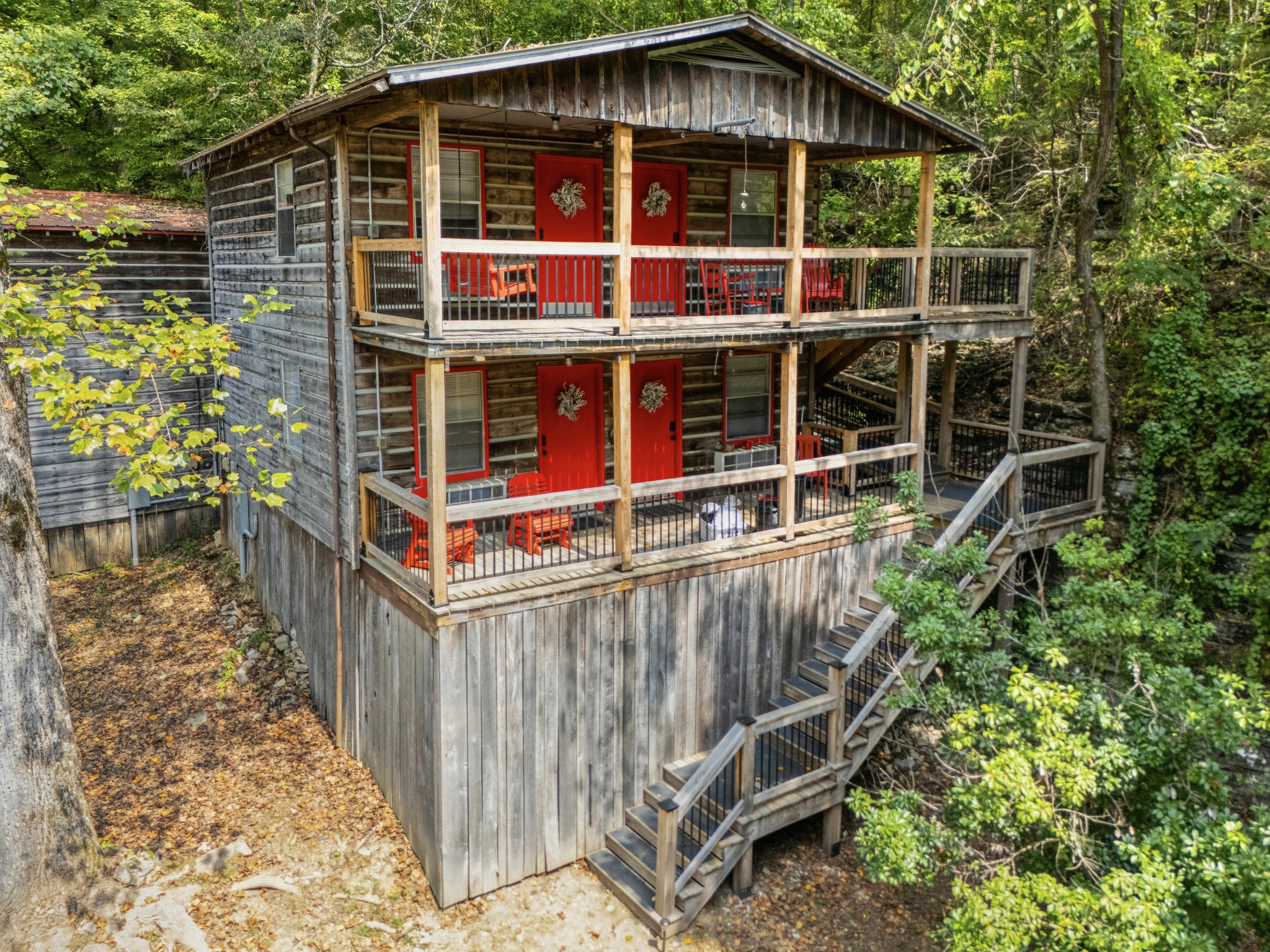 299 Natural Bridge Park Road Waynesboro, TN 38485 - Photo 51 of 63 a view of a wooden house with a small yard and wooden fence