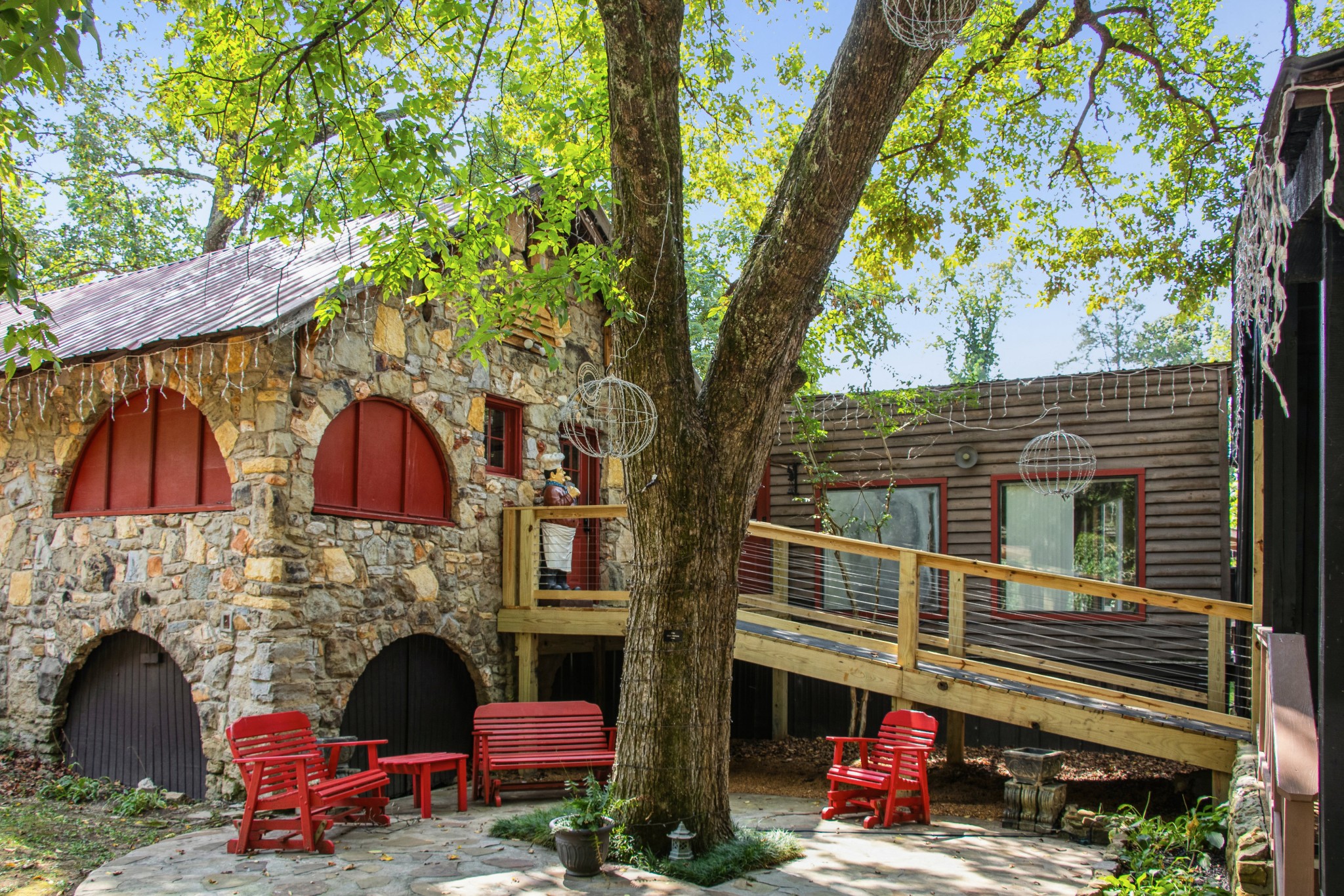 299 Natural Bridge Park Road Waynesboro, TN 38485 - Photo 7 of 63 a backyard of the house with outdoor seating