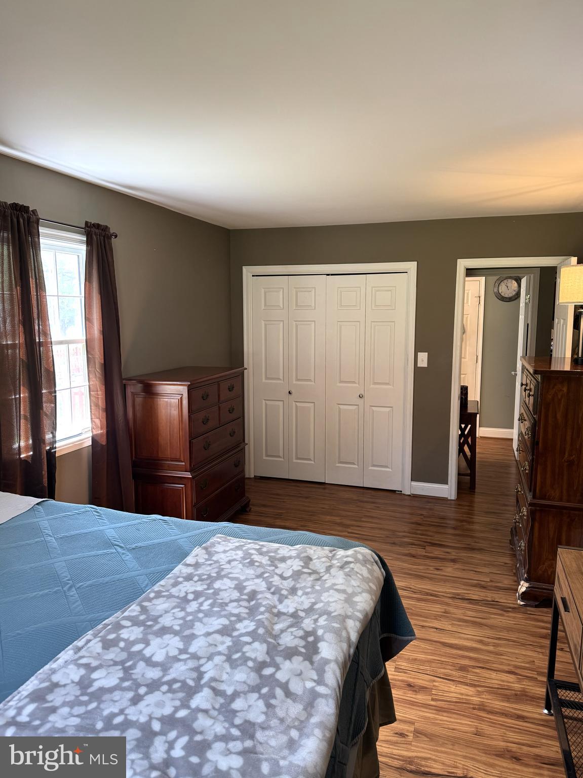 26210 Oak Grove Road Seaford, DE 19973 - Photo 11 of 33 a bedroom with a bed and wooden floor