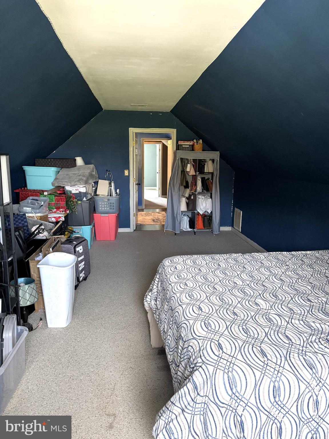 26210 Oak Grove Road Seaford, DE 19973 - Photo 25 of 33 a bed room with a bed and a large mirror