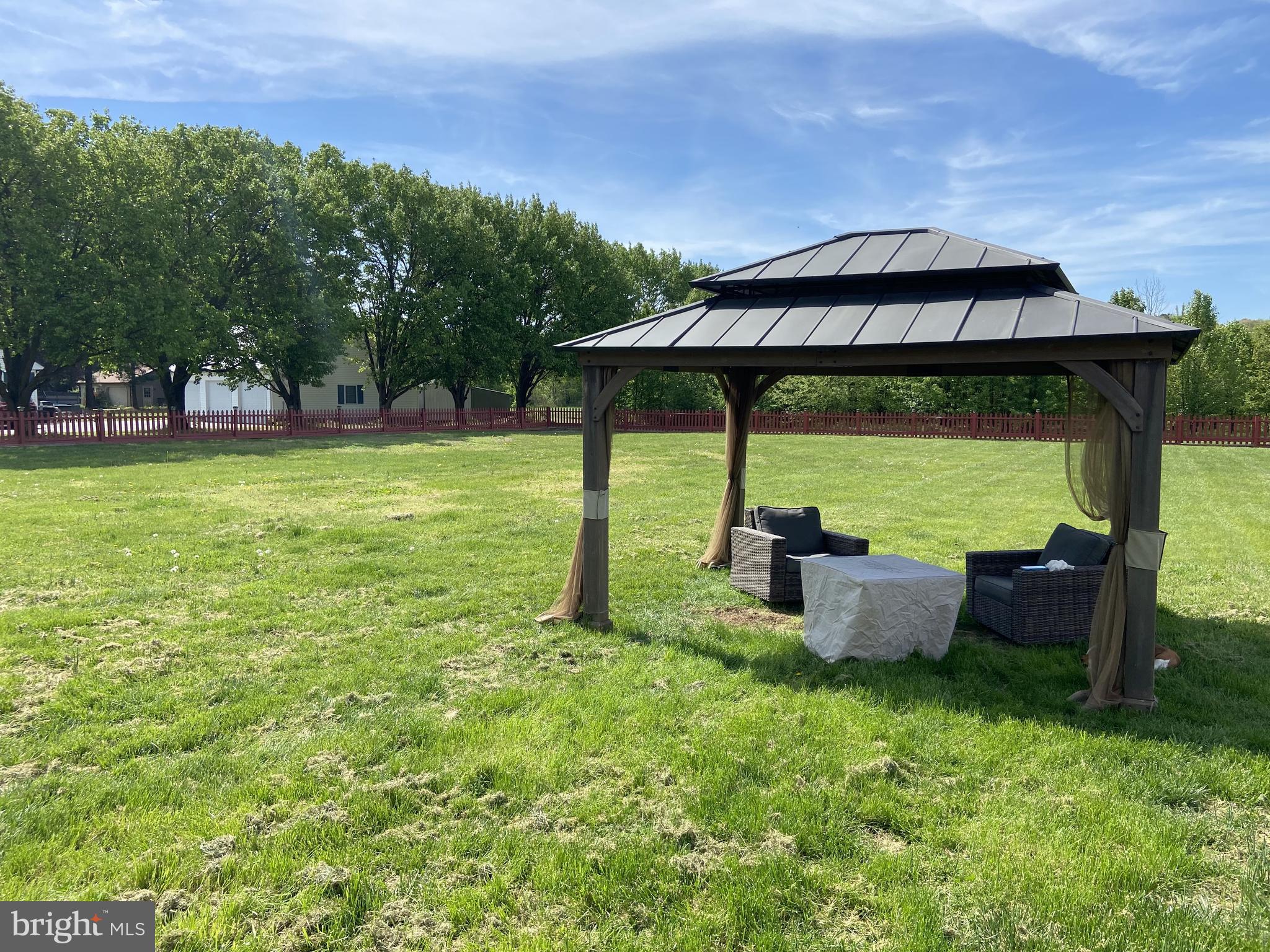 26210 Oak Grove Road Seaford, DE 19973 - Photo 31 of 33 a view of a couches and table in the garden