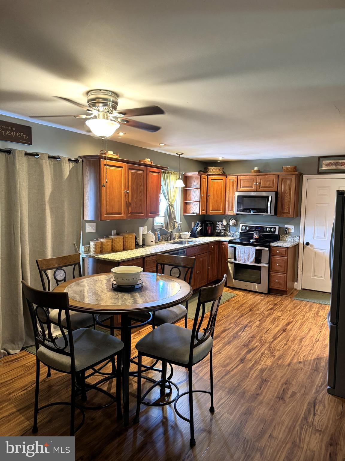 26210 Oak Grove Road Seaford, DE 19973 - Photo 6 of 33 a view of a dining room with furniture and a chandelier