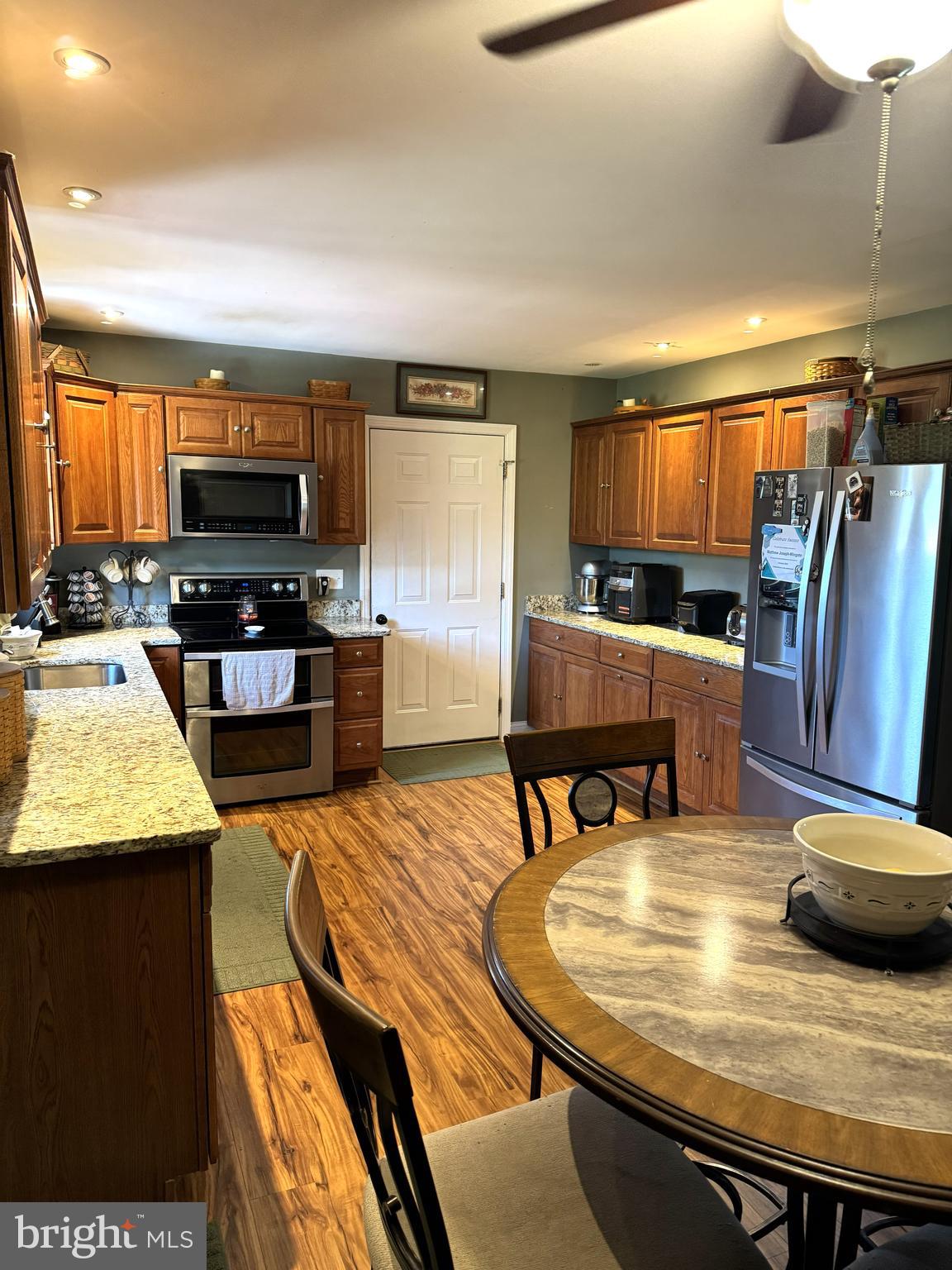 26210 Oak Grove Road Seaford, DE 19973 - Photo 7 of 33 a living room with stainless steel appliances furniture and a kitchen view