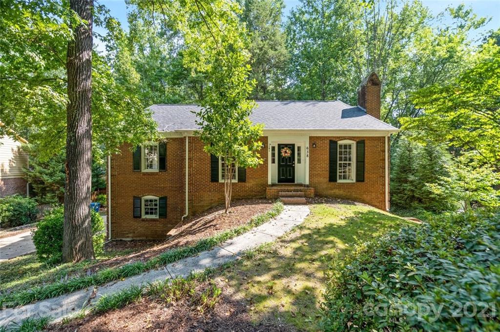 638 Trail Ridge Road Matthews, NC 28105 - Photo 1 of 36 a front view of a house with a yard and garage