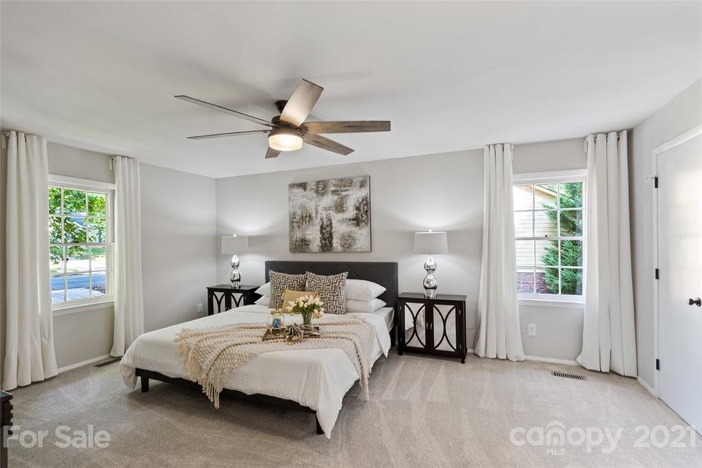 638 Trail Ridge Road Matthews, NC 28105 - Photo 14 of 36 a bedroom with a large bed and a window