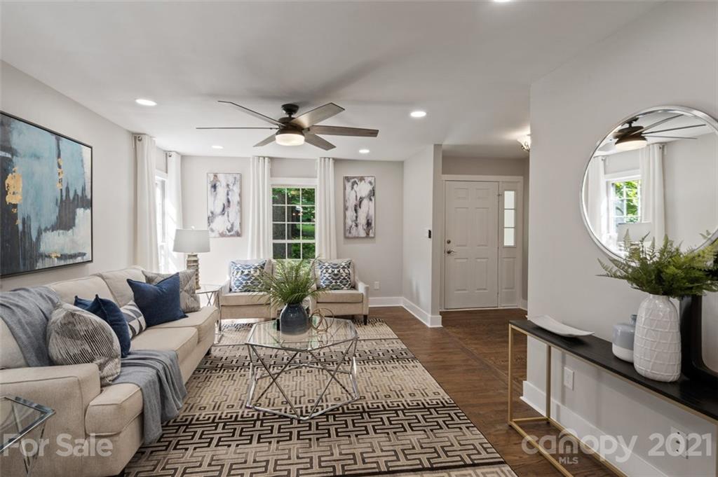 638 Trail Ridge Road Matthews, NC 28105 - Photo 3 of 36 a living room with furniture and a wooden floor