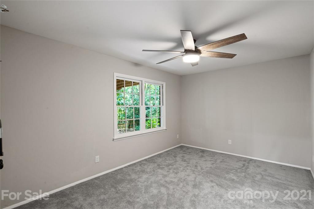 638 Trail Ridge Road Matthews, NC 28105 - Photo 23 of 36 an empty room with a window and a fan