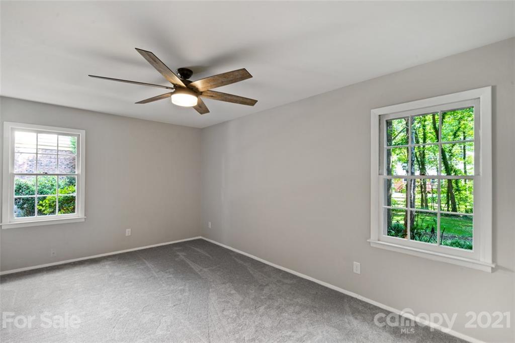 638 Trail Ridge Road Matthews, NC 28105 - Photo 24 of 36 an empty room with a window and a fan