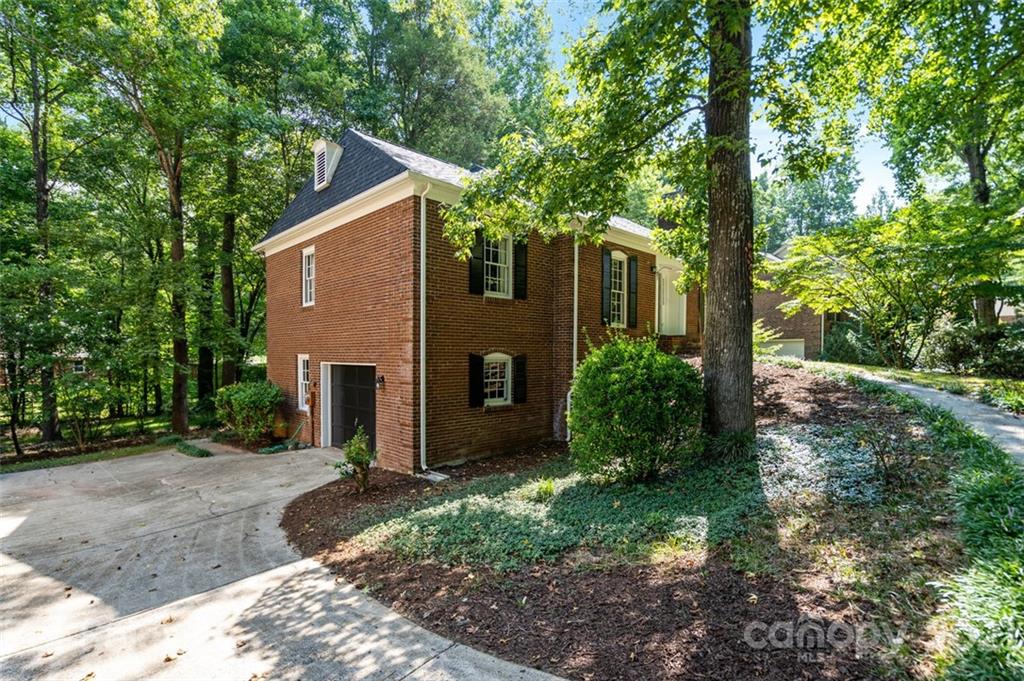 638 Trail Ridge Road Matthews, NC 28105 - Photo 31 of 36 a view of a house with a yard and large tree