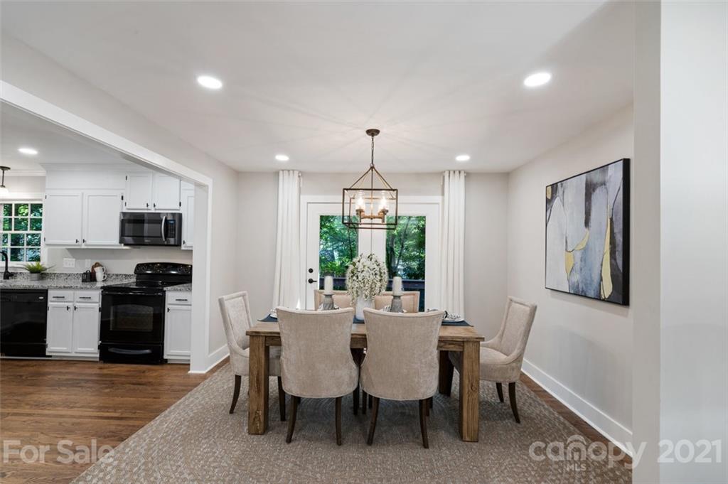 638 Trail Ridge Road Matthews, NC 28105 - Photo 7 of 36 a view of a dining room with furniture window and wooden floor