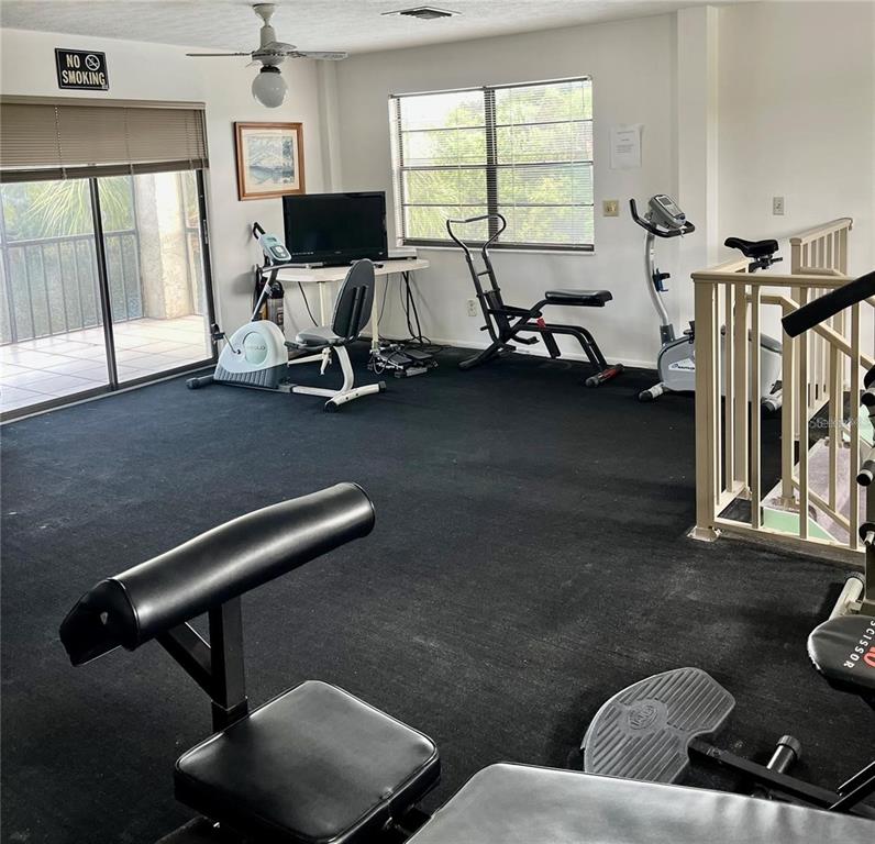 5640 Ferguson Court, Unit 2205 New Port Richey, FL 34652 - Photo 20 of 23 a living room with furniture a air conditioner vent and a window