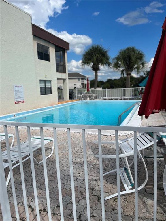 5640 Ferguson Court, Unit 2205 New Port Richey, FL 34652 - Photo 23 of 23 a view of a house with a backyard