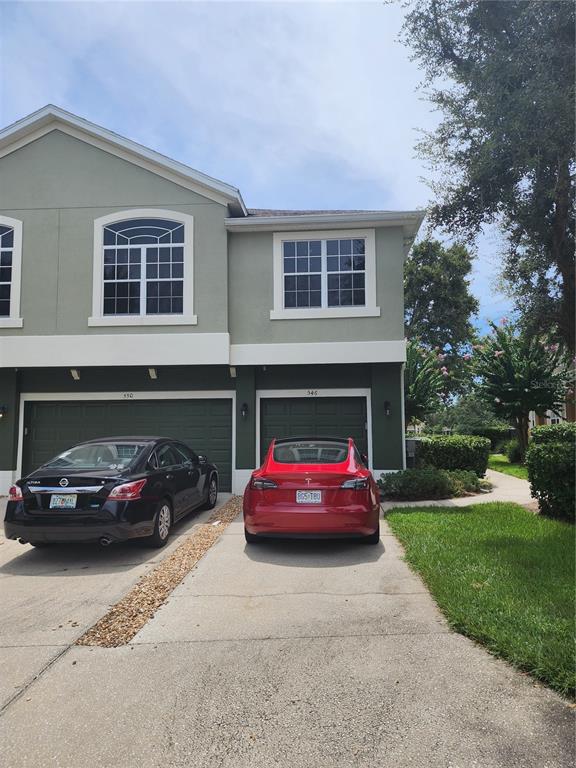 546 Climbing Ivy Court, Unit C Apopka, FL 32712 - Photo 1 of 26 a view of a car parked in front of a house