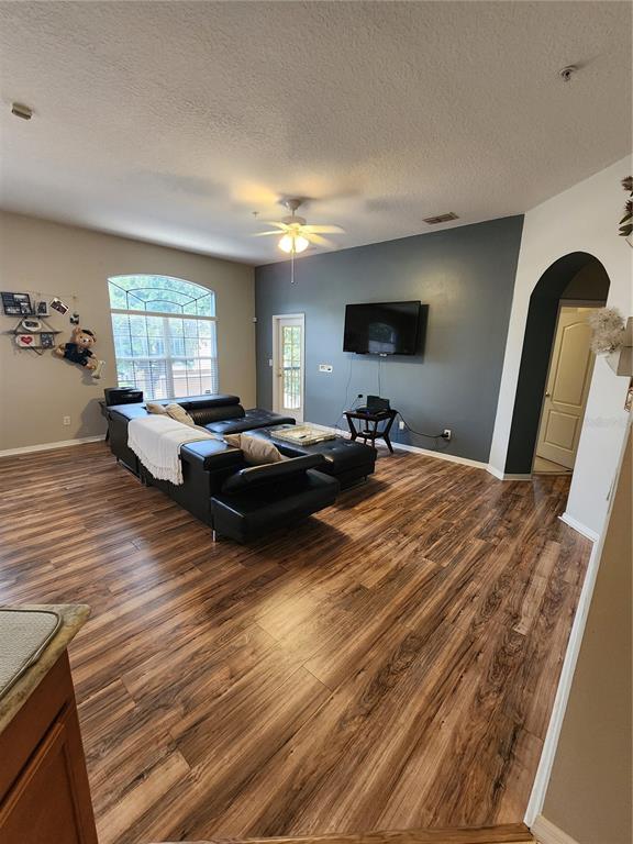 546 Climbing Ivy Court, Unit C Apopka, FL 32712 - Photo 12 of 26 a bed room with a bed window and mirror