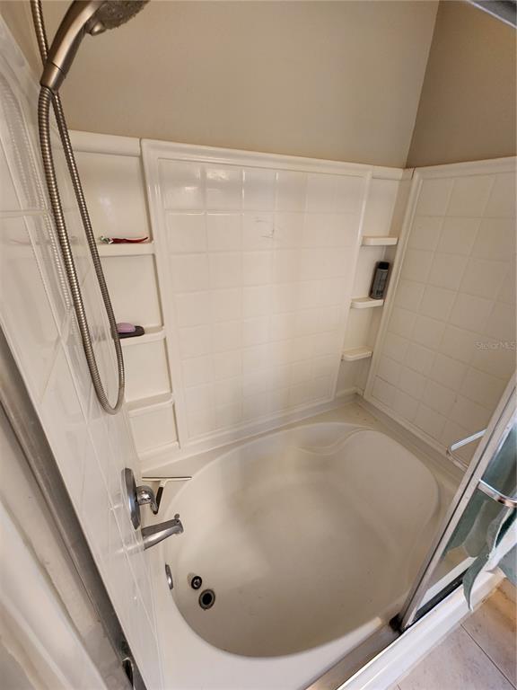 546 Climbing Ivy Court, Unit C Apopka, FL 32712 - Photo 18 of 26 a bathroom with a bathtub