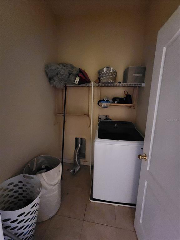 546 Climbing Ivy Court, Unit C Apopka, FL 32712 - Photo 22 of 26 a bathroom with a toilet and a shower