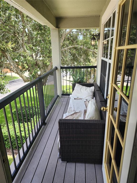 546 Climbing Ivy Court, Unit C Apopka, FL 32712 - Photo 23 of 26 a view of balcony with furniture