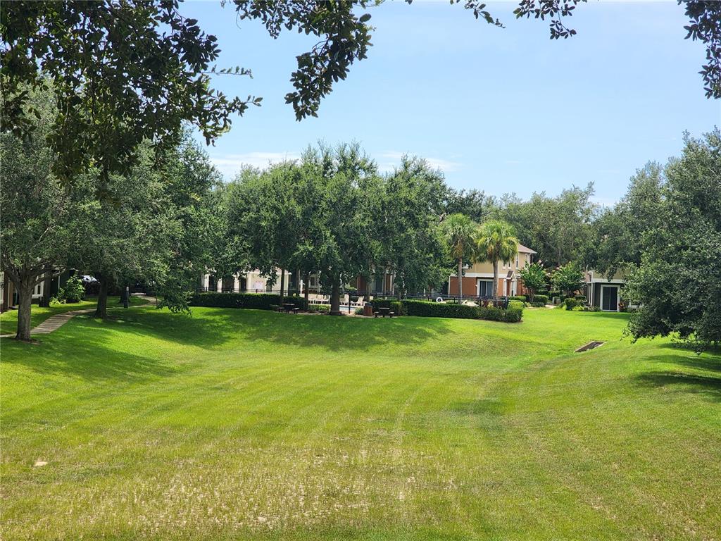 546 Climbing Ivy Court, Unit C Apopka, FL 32712 - Photo 4 of 26 a view of a trees in front of a house