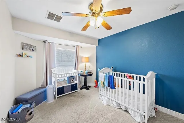 a bedroom with furniture and a window