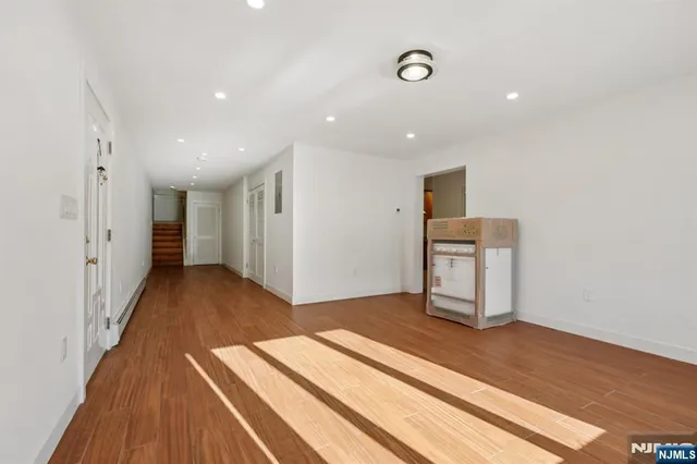a view of livingroom with hardwood floor and hallway