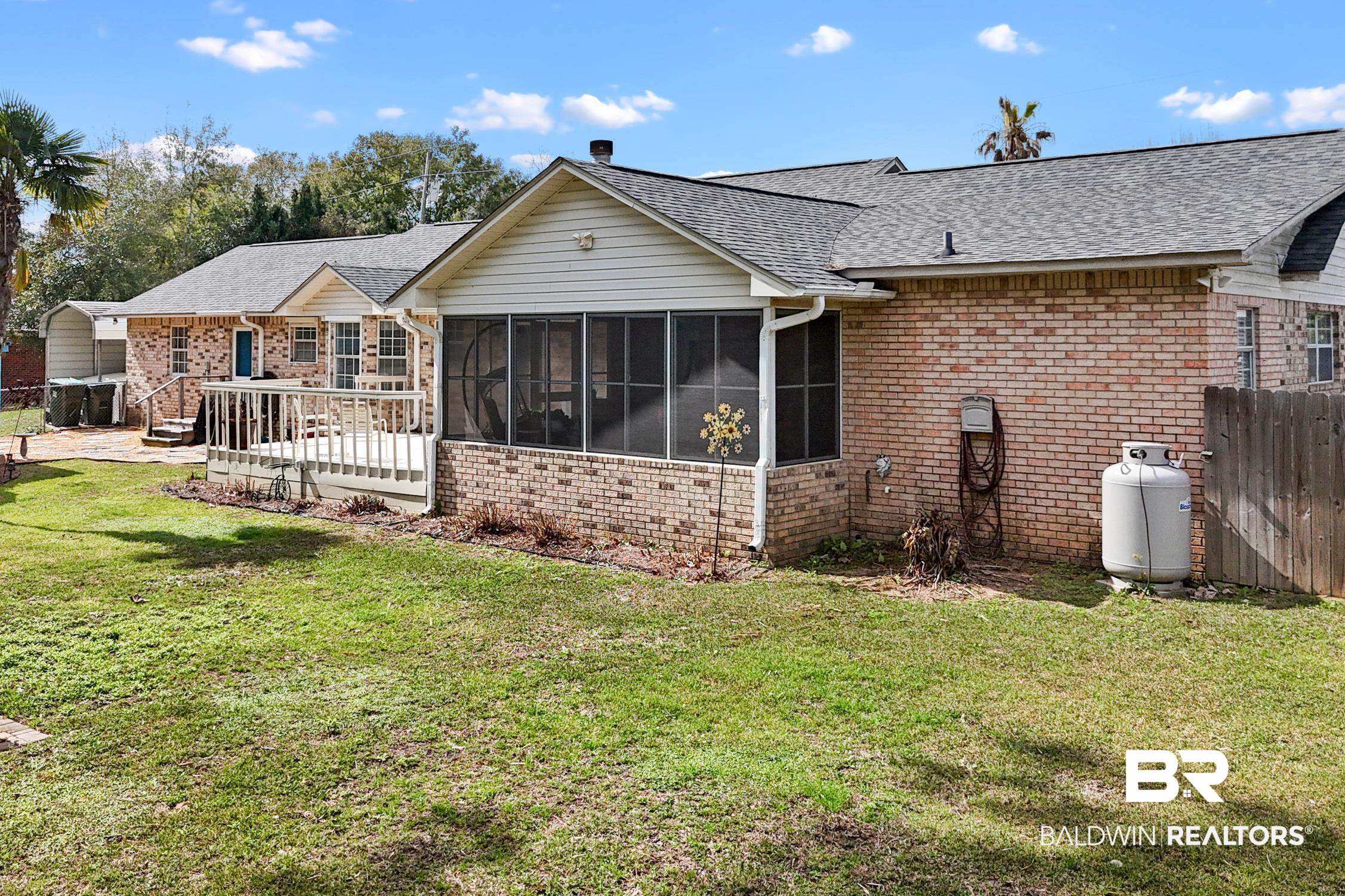 2553 Santa Rosa Drive Lillian, AL 36549 - Photo 47 of 51 Back of property with a yard, fence, and a sunroom