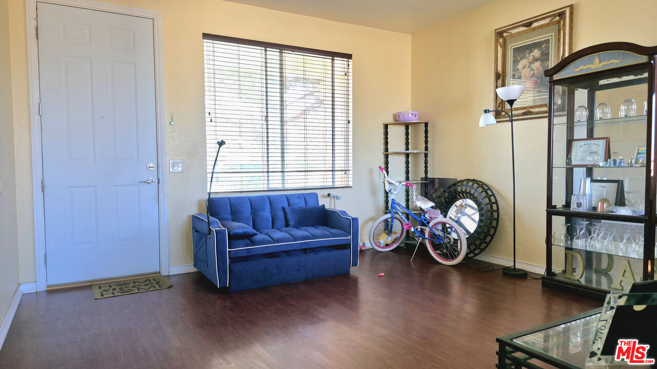 11532 Autumn Street Adelanto, CA 92301 - Photo 4 of 32 a living room with furniture and a window