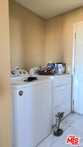 a utility room with washer and dryer