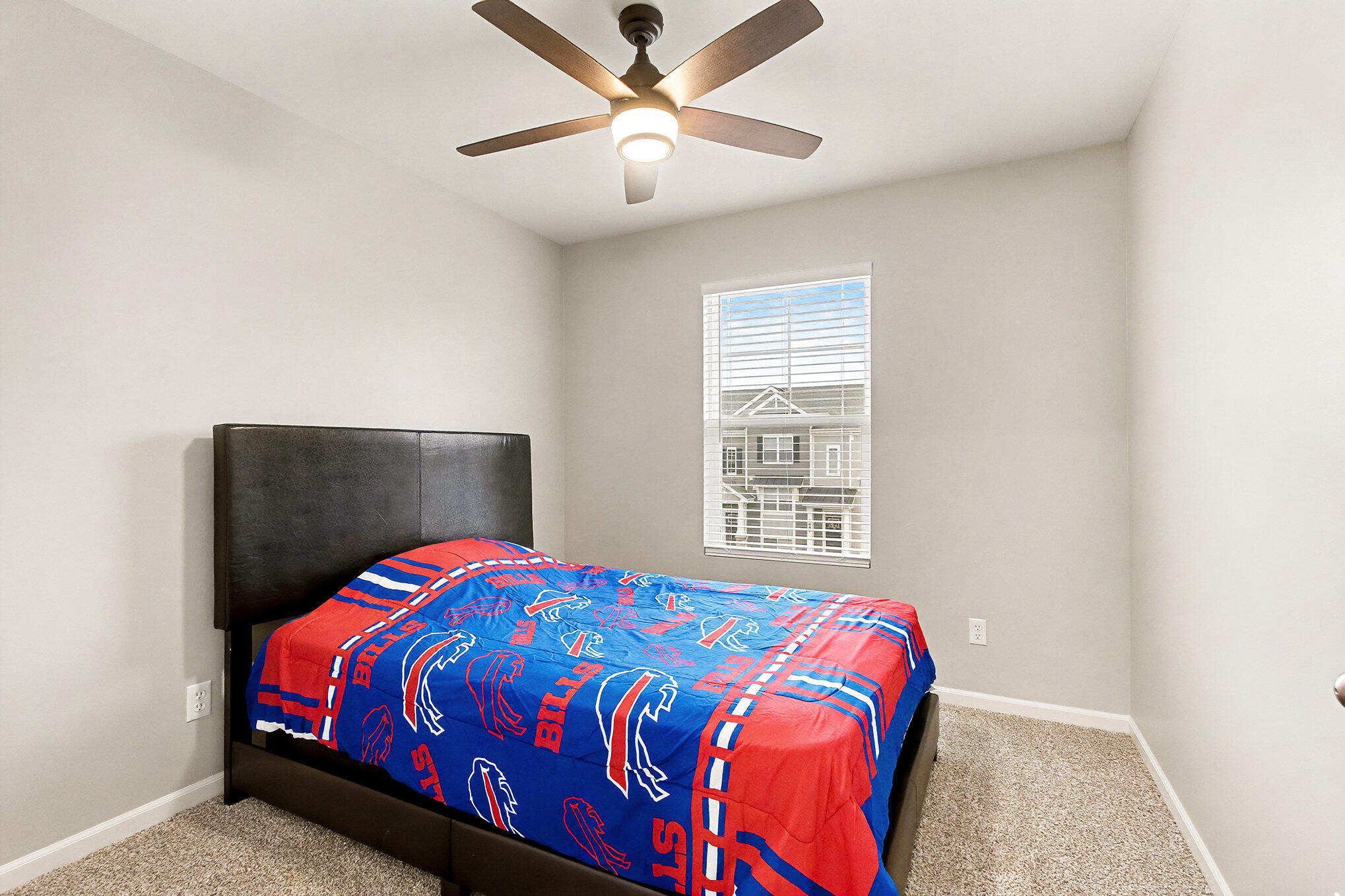 8690 Larkspur Lane St. John, IN 46373 - Photo 14 of 21 a bedroom with a bed and a chandelier