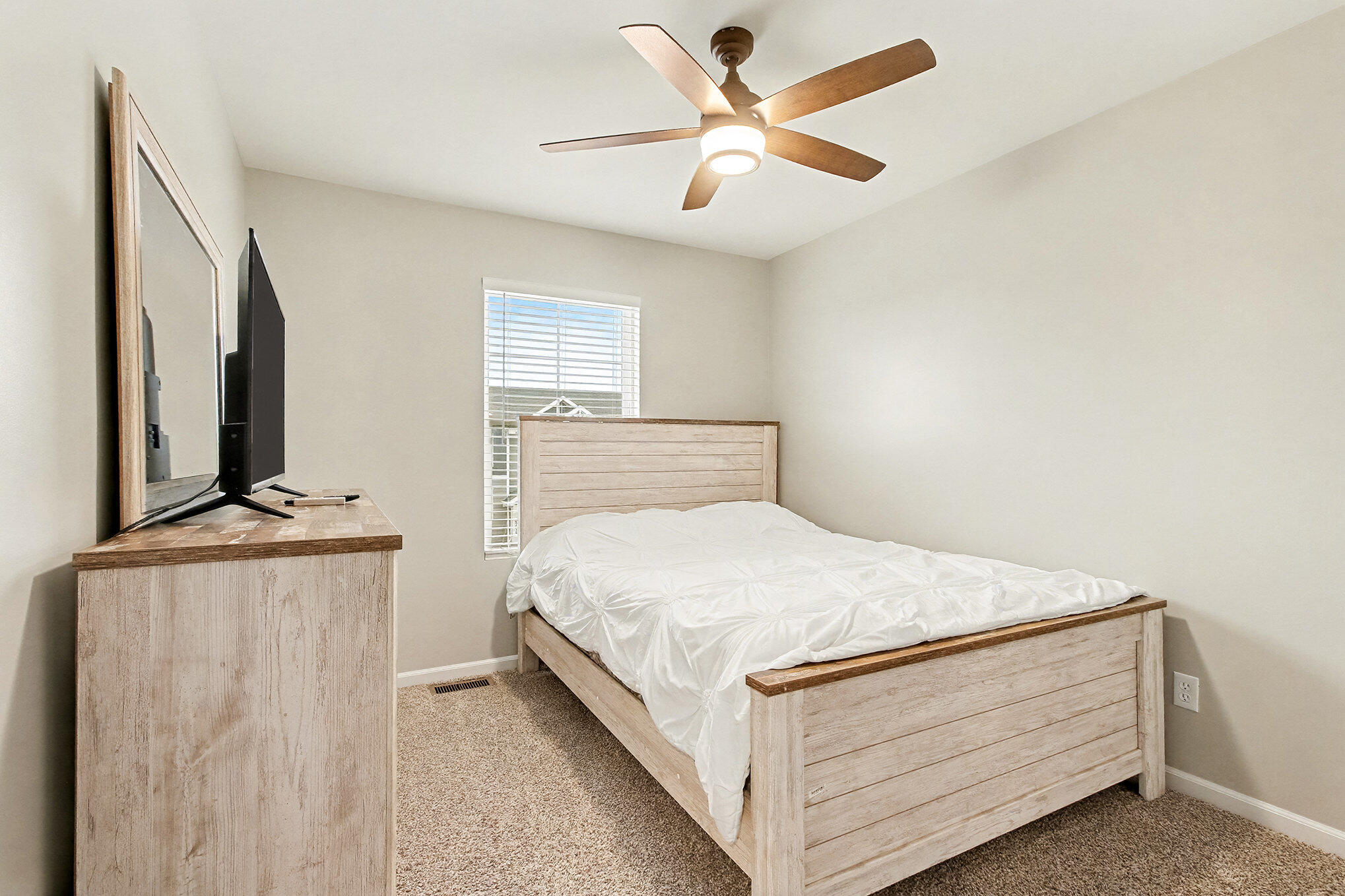 8690 Larkspur Lane St. John, IN 46373 - Photo 15 of 21 a bedroom with a bed and a chandelier