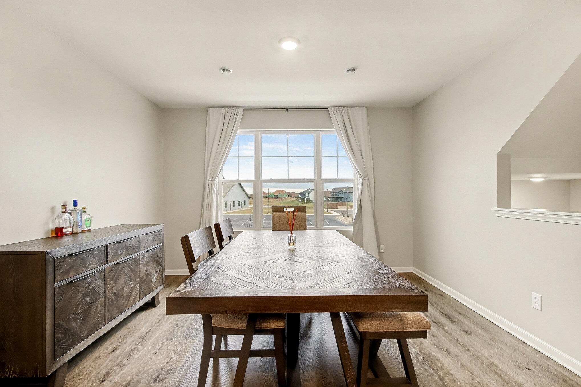 8690 Larkspur Lane St. John, IN 46373 - Photo 8 of 21 a view of a dining room with furniture window and wooden floor