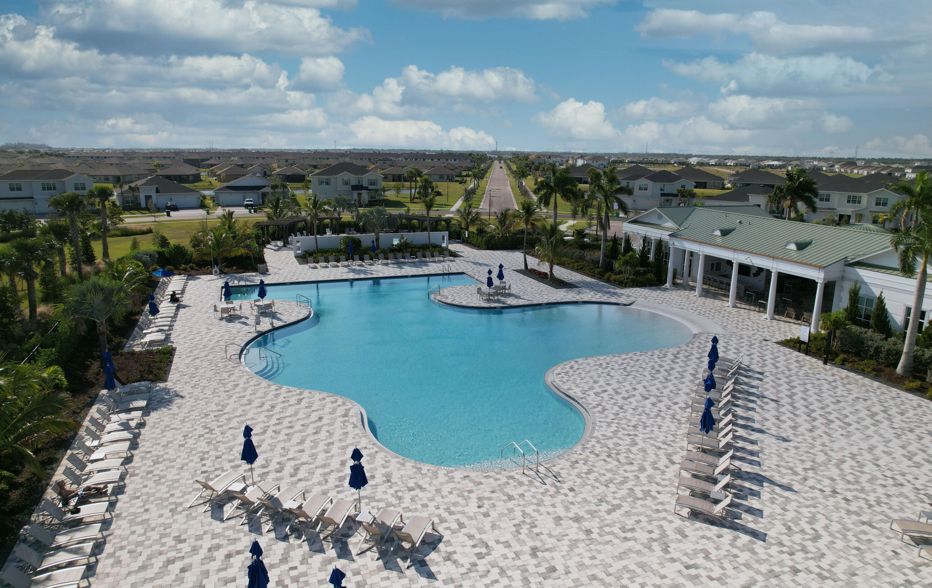 9400 Southwest Libertas Way Port Port St. Lucie, FL 34987 - Photo 45 of 47 a view of a swimming pool and lounge chair