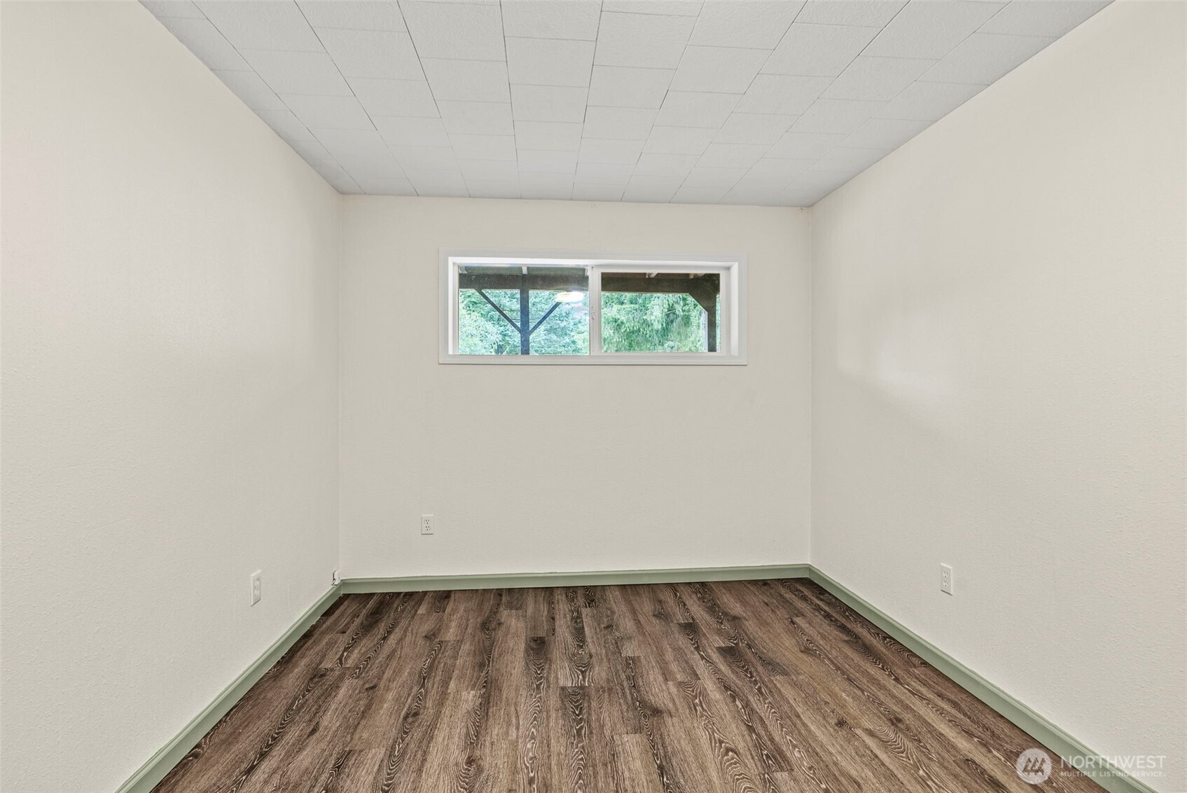 652 Ragland Road Longview, WA 98632 - Photo 28 of 40 a view of a room with wooden floor and window