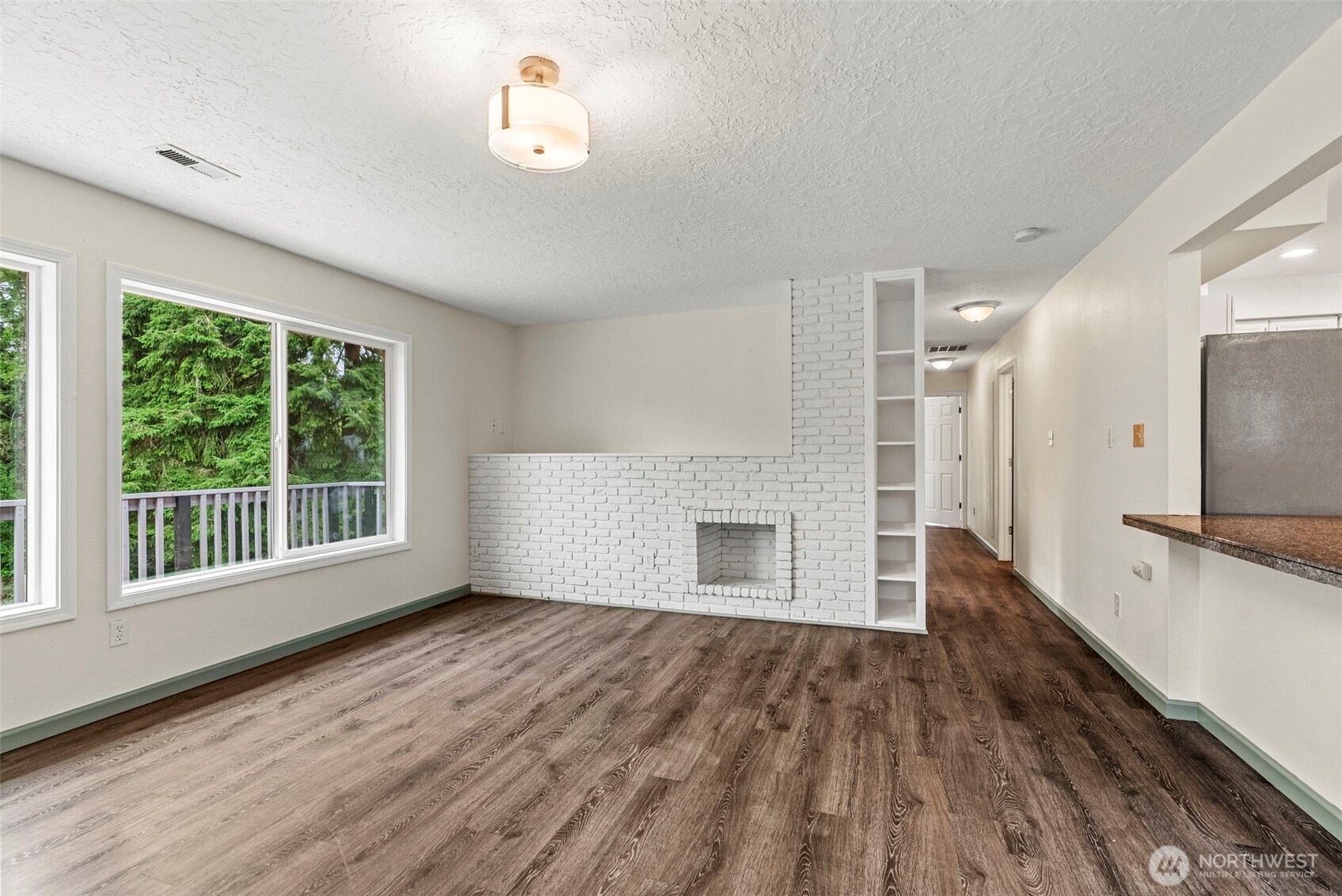 652 Ragland Road Longview, WA 98632 - Photo 7 of 40 a view of empty room with wooden floor and fan