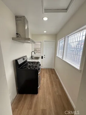a kitchen with a stove and a refrigerator