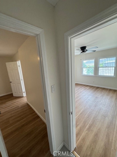 11222 1/2 Concert Street El Monte, CA 91731 - Photo 7 of 15 a view of a hallway to a room with wooden floor and windows