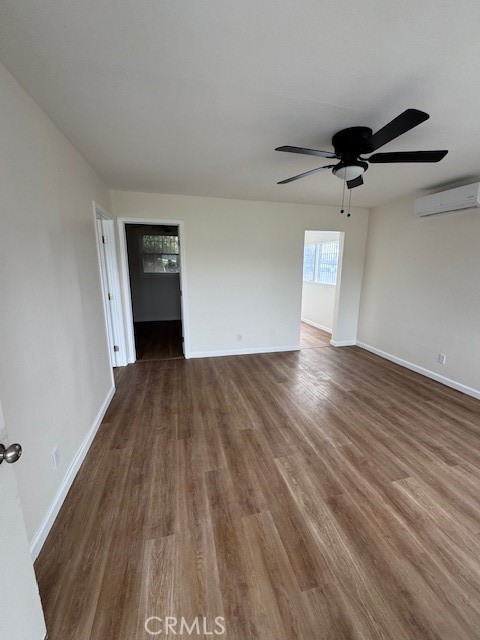 11222 1/2 Concert Street El Monte, CA 91731 - Photo 9 of 15 a view of a room with wooden floor and a ceiling fan
