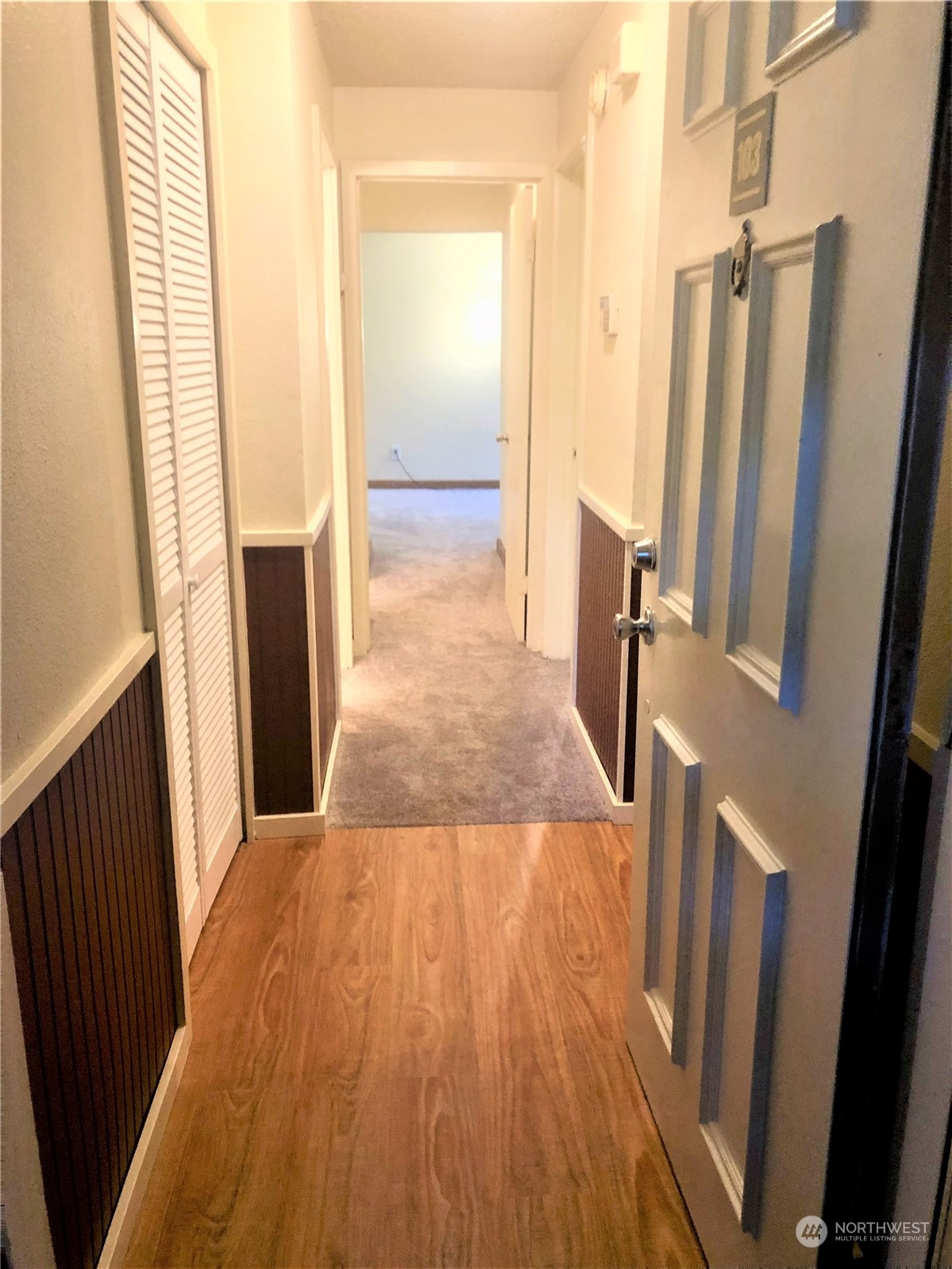 2534 South 317th Street, Unit 103 Federal Way, WA 98003 - Photo 8 of 8 a view of a kitchen from a hallway
