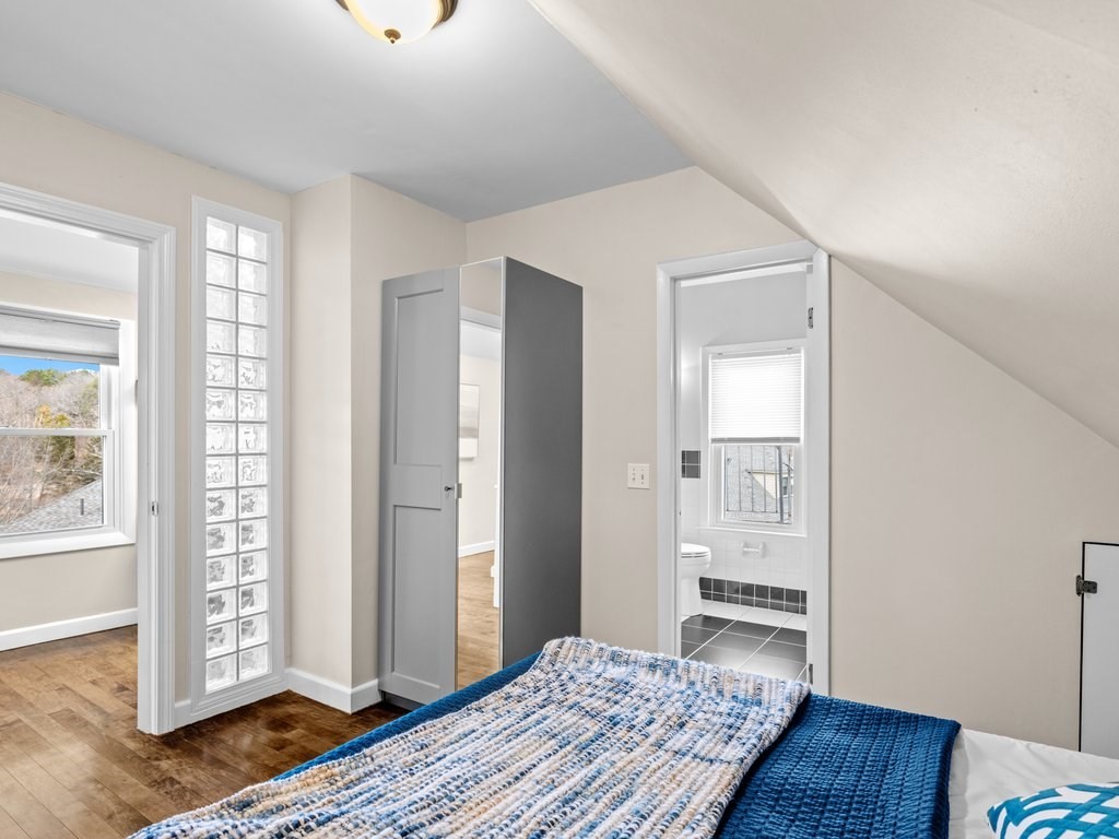 47 R Jamaica Street, Unit 3 Boston, MA 02130 - Photo 11 of 18 a bedroom with a bed and wooden floor