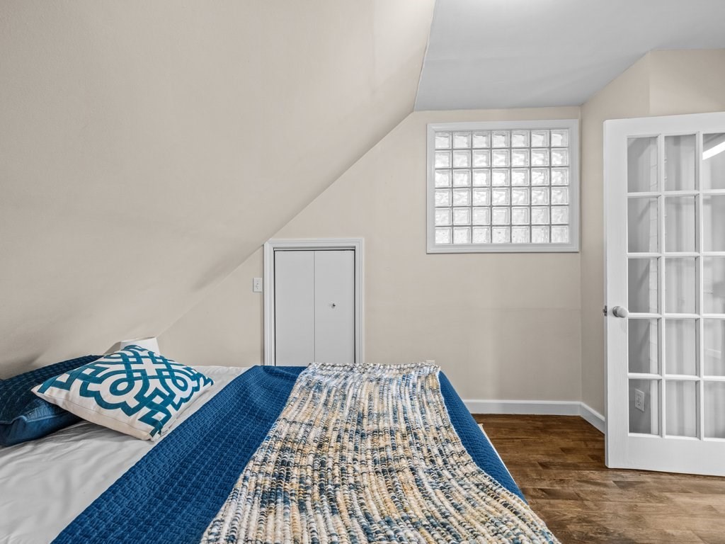 47 R Jamaica Street, Unit 3 Boston, MA 02130 - Photo 12 of 18 a view of a bedroom with wooden floor and window