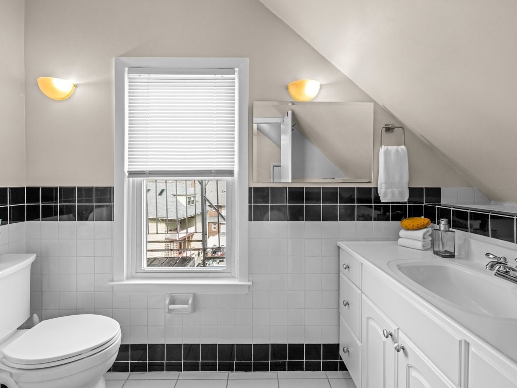 47 R Jamaica Street, Unit 3 Boston, MA 02130 - Photo 13 of 18 a bathroom with a sink a toilet and shower