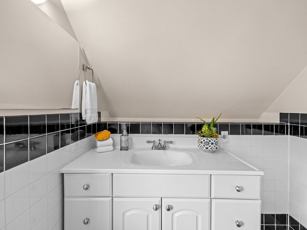 47 R Jamaica Street, Unit 3 Boston, MA 02130 - Photo 15 of 18 a kitchen with a sink and white cabinets