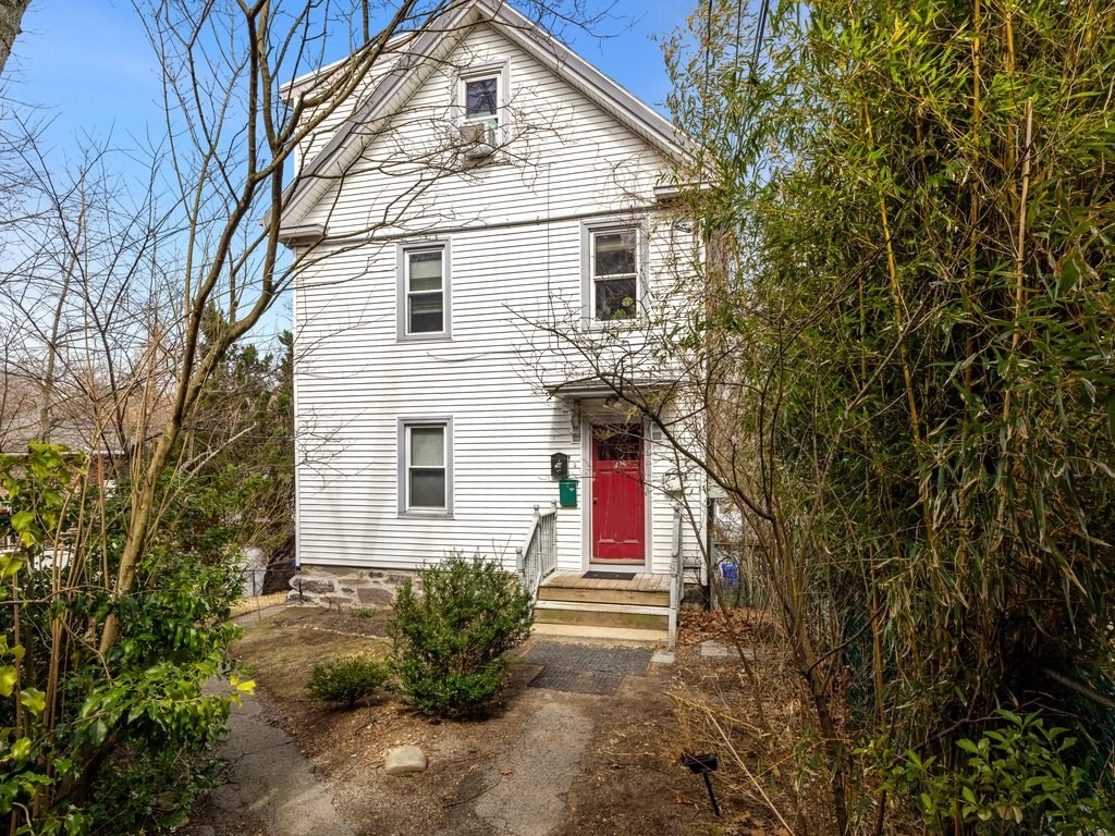 47 R Jamaica Street, Unit 3 Boston, MA 02130 - Photo 16 of 18 a front view of a house with yard