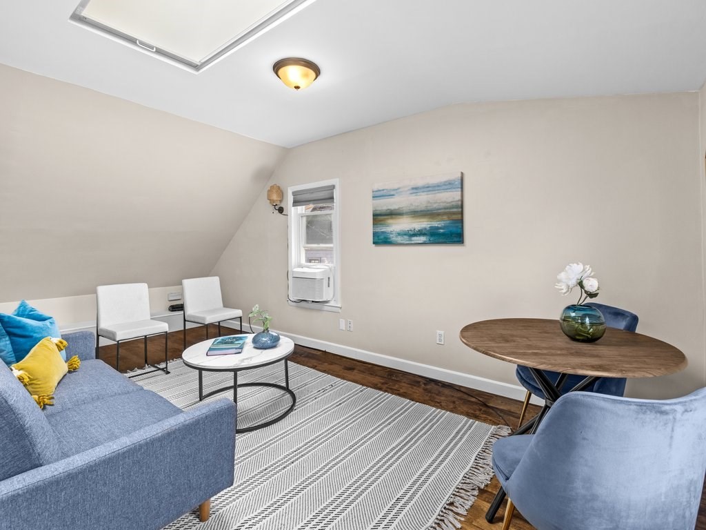 47 R Jamaica Street, Unit 3 Boston, MA 02130 - Photo 2 of 18 a living room with furniture and white walls