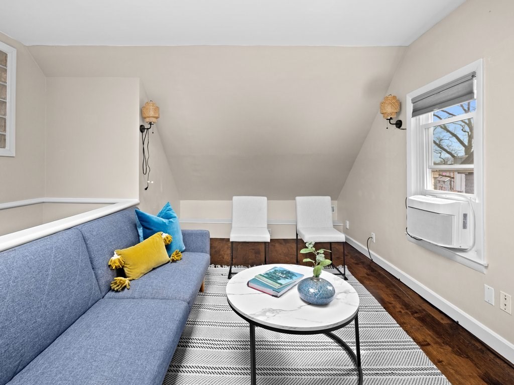 47 R Jamaica Street, Unit 3 Boston, MA 02130 - Photo 3 of 18 a living room with furniture and wooden floor