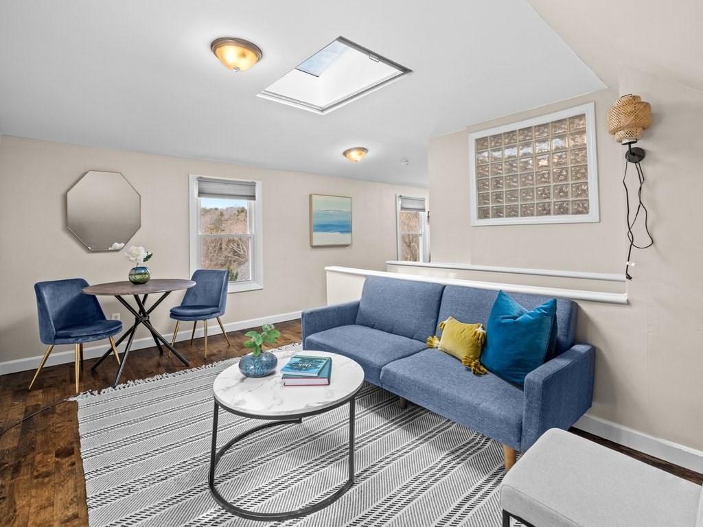 47 R Jamaica Street, Unit 3 Boston, MA 02130 - Photo 4 of 18 a living room with furniture and a wooden floor