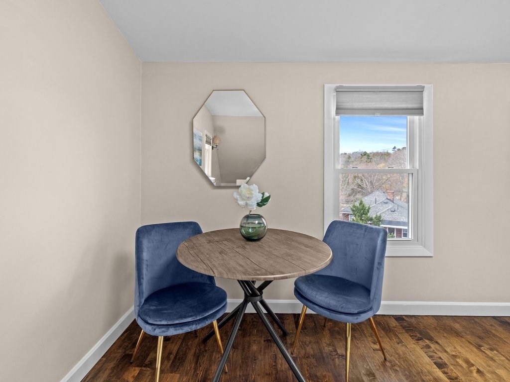 47 R Jamaica Street, Unit 3 Boston, MA 02130 - Photo 5 of 18 a view of a dining room with furniture and wooden floor