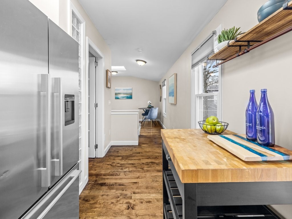 47 R Jamaica Street, Unit 3 Boston, MA 02130 - Photo 8 of 18 a dining room with furniture and wooden floor