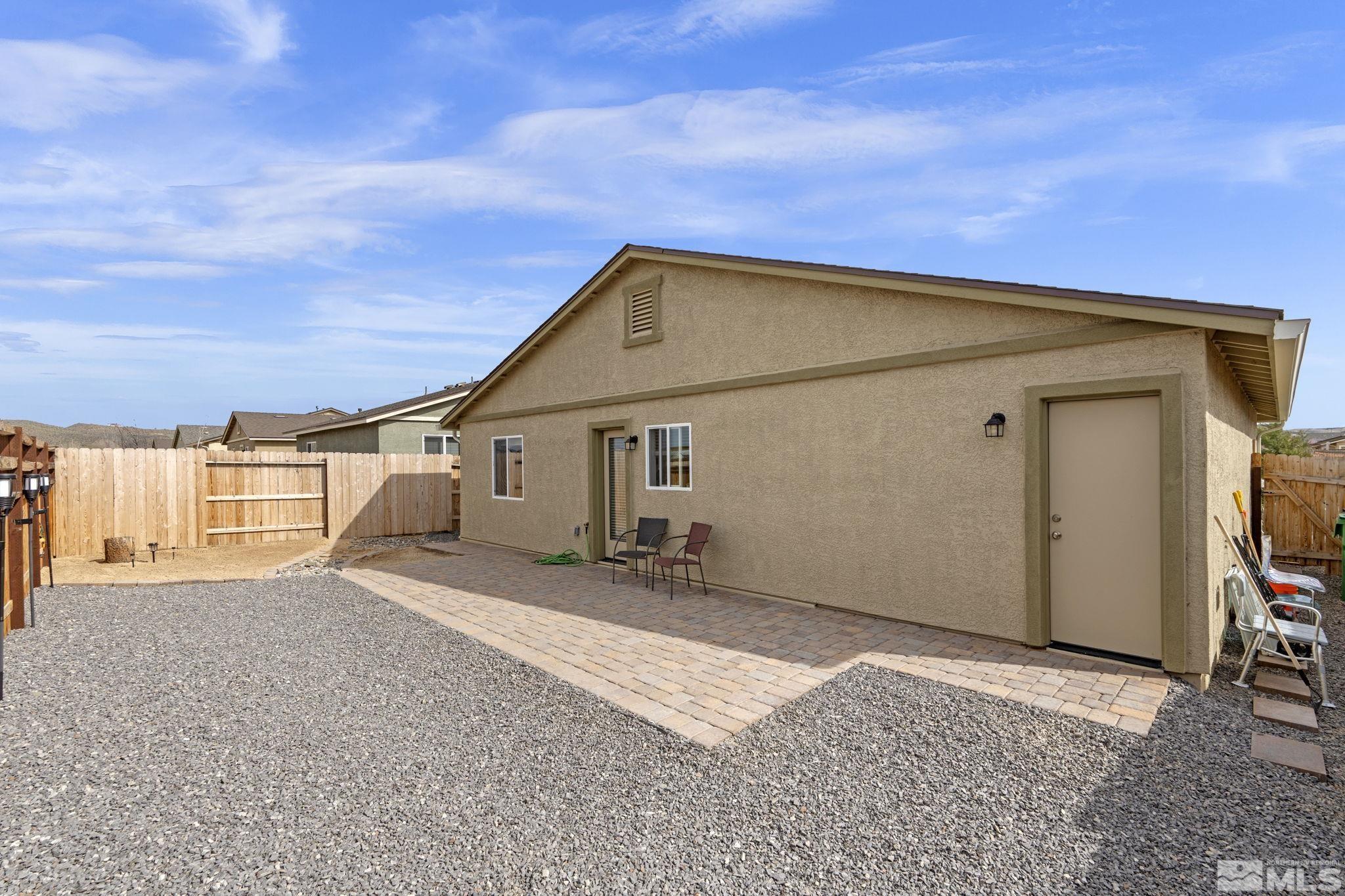 677 Mcgill Drive Reno, NV 89506 - Photo 11 of 29 a backyard of a house with table and chairs